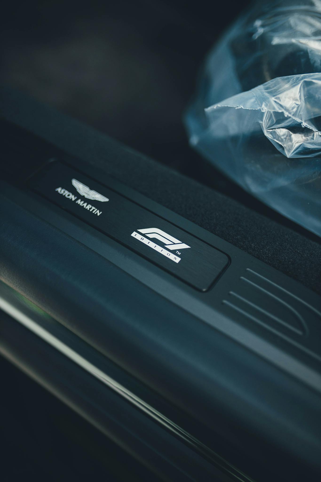 Close-up shot of a luxury car logo interior branding in New Delhi, India.