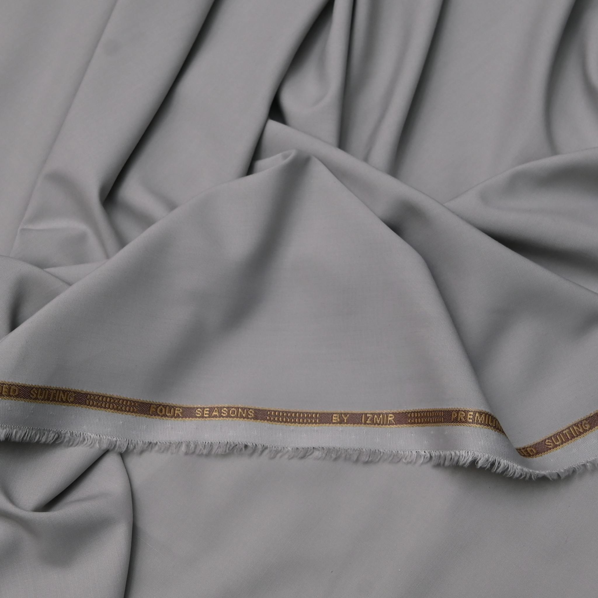 Premium grey suiting fabric featuring 'Four Seasons' branding detail.